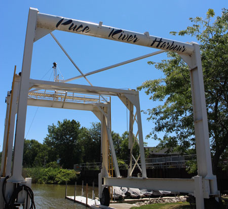 Puce River Sign